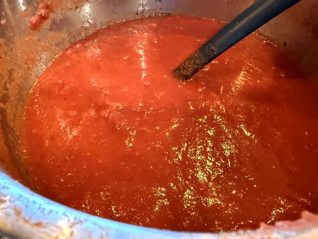 Scratch marinara simmering on the stove